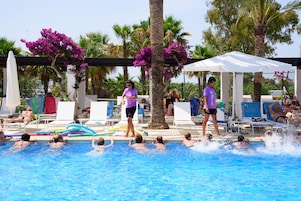 Seasonal outdoor pool, open 10:30 AM to 6:30 PM, pool umbrellas