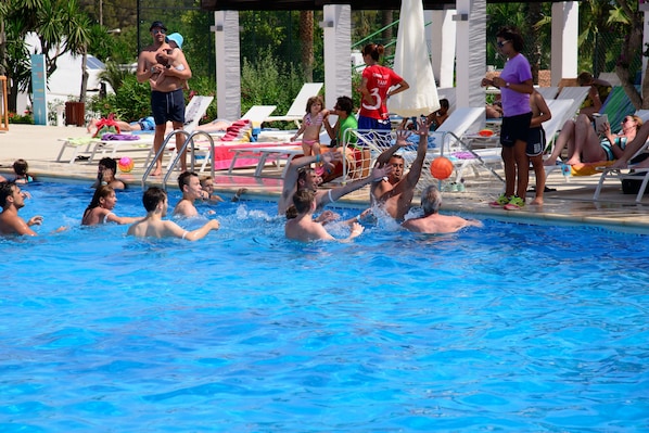 Seasonal outdoor pool, open 10:30 AM to 6:30 PM, pool umbrellas