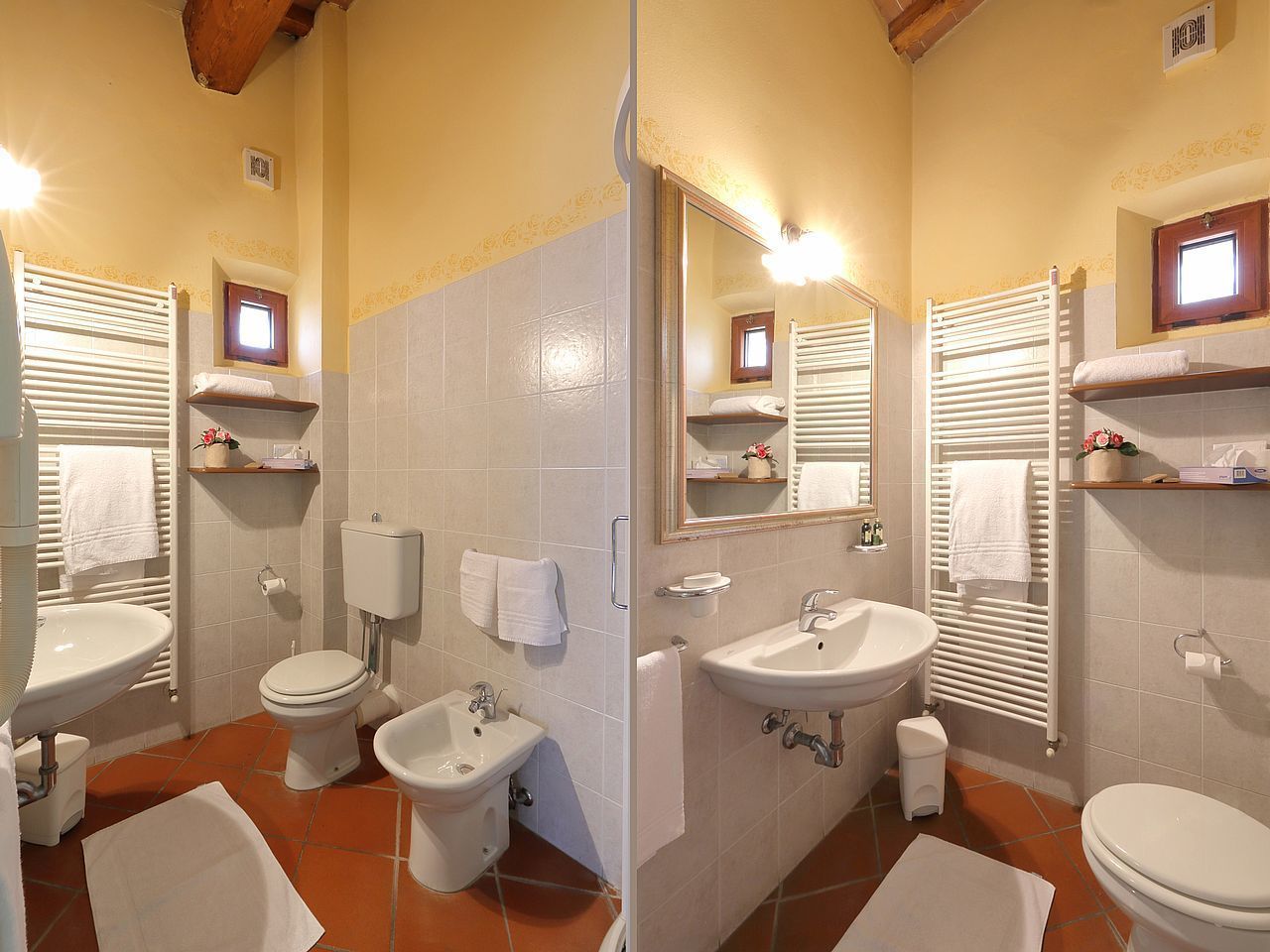 A bathroom with a toilet, bidet, sink, and mirror.