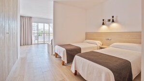 A hotel room with two beds, a wooden headboard, a nightstand, and a large window with curtains. - Sunside Ibiza Studios - Adults Only (Sant Antoni de Portmany)