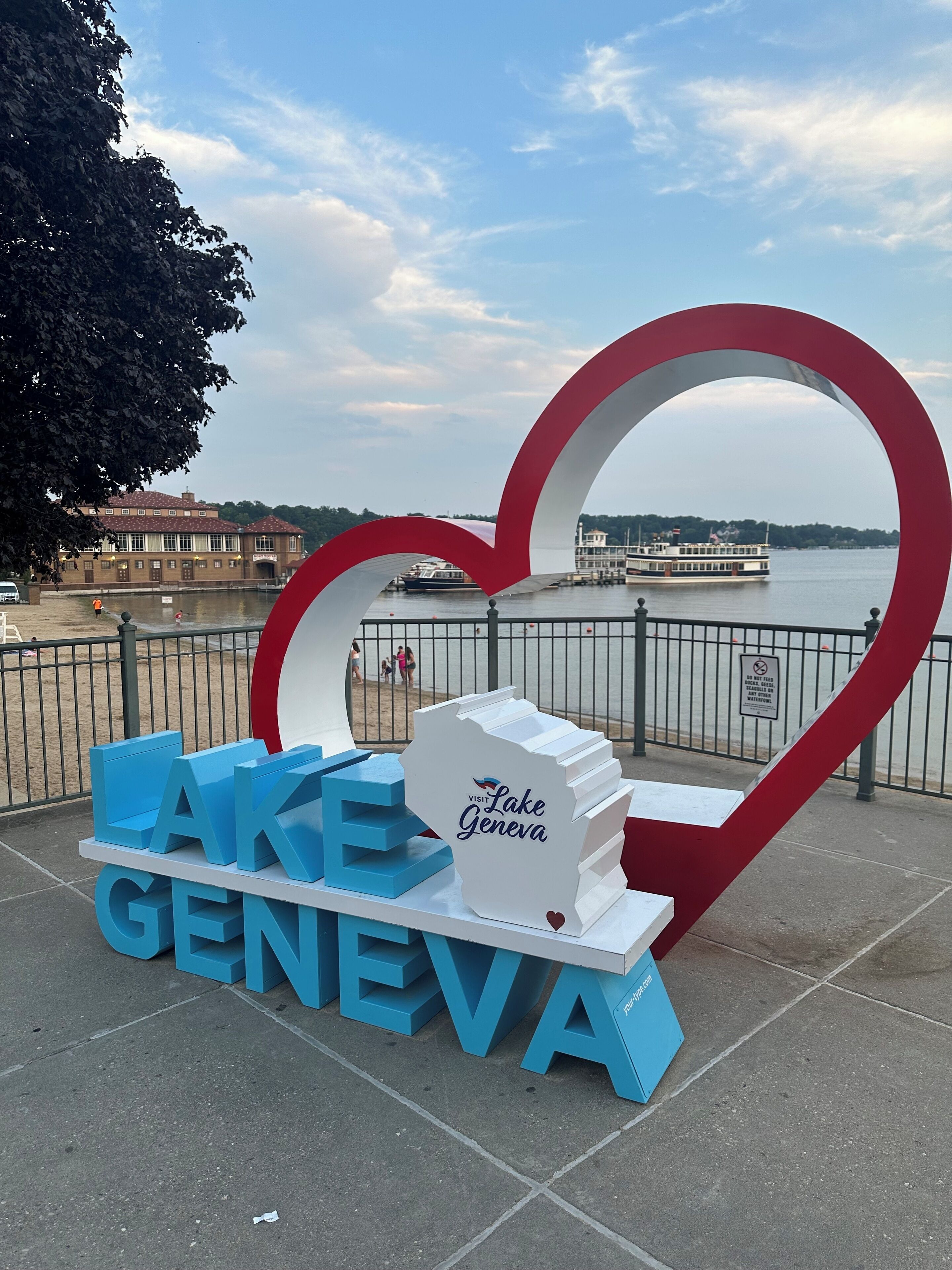 A sign with 'LAKE GENEVA' and a heart-shaped structure.