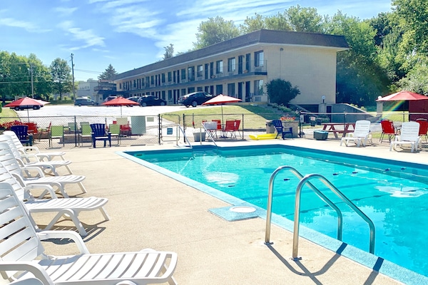 Seasonal outdoor pool, open 9:30 AM to 8:00 PM, pool umbrellas