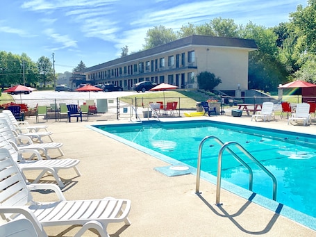 Seasonal outdoor pool, open 9:30 AM to 8:00 PM, pool umbrellas. Geneva Wells Inn