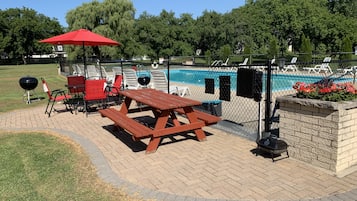 Relax by the pool with a barbecue and outdoor dining facilities.