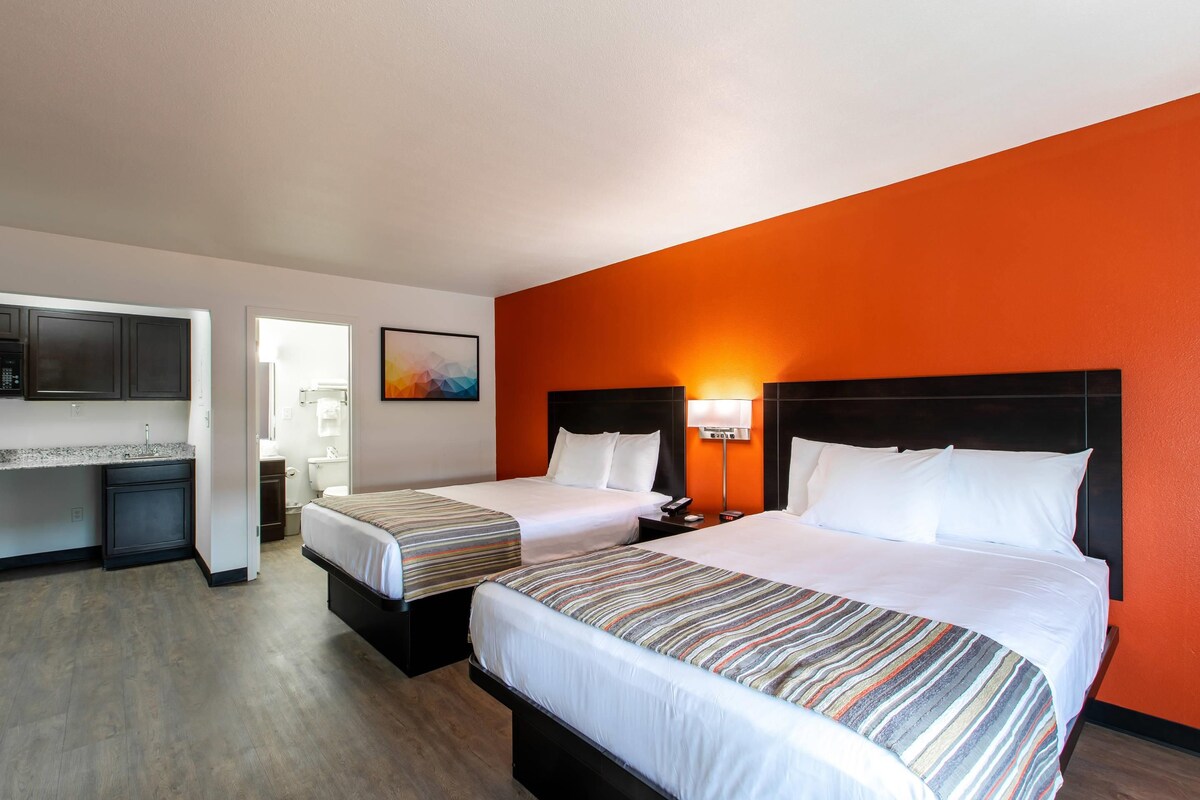 Deluxe Room, 2 Queen Bed, Non-Smoking, Kitchenette | Pillowtop beds, desk, laptop workspace, blackout drapes
