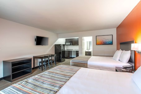 Deluxe Room, 2 Queen Bed, Non-Smoking, Kitchenette | Pillowtop beds, individually furnished, desk, laptop workspace