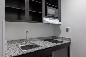 Full-sized fridge, microwave, stovetop, coffee/tea maker
