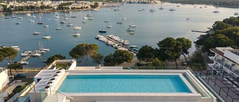 Seasonal outdoor pool, pool umbrellas, pool loungers
