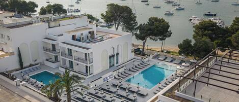 Seasonal outdoor pool, pool umbrellas, pool loungers
