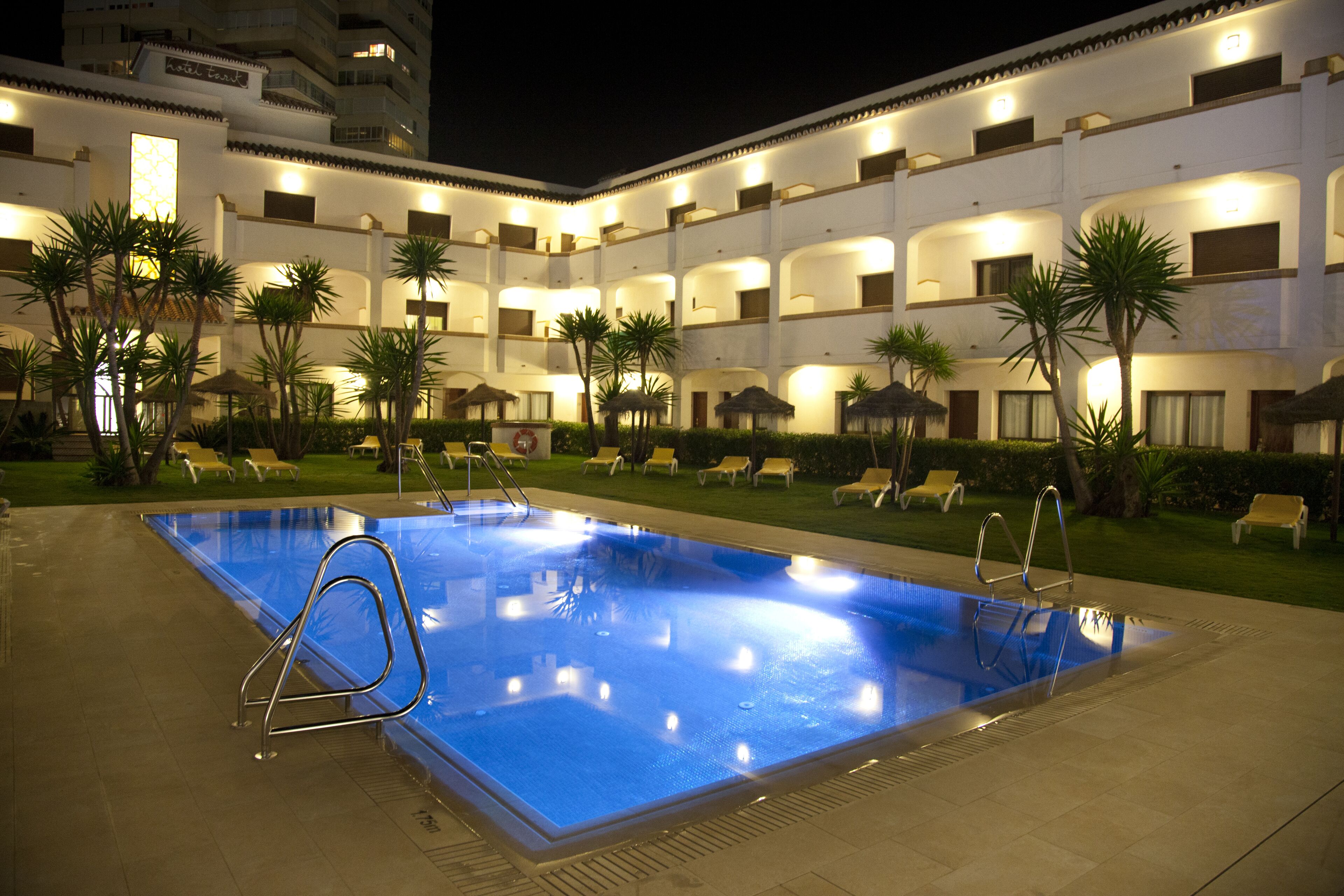 outdoor pool, open 10:00 am to 8:00 pm, pool umbrellas, pool loungers