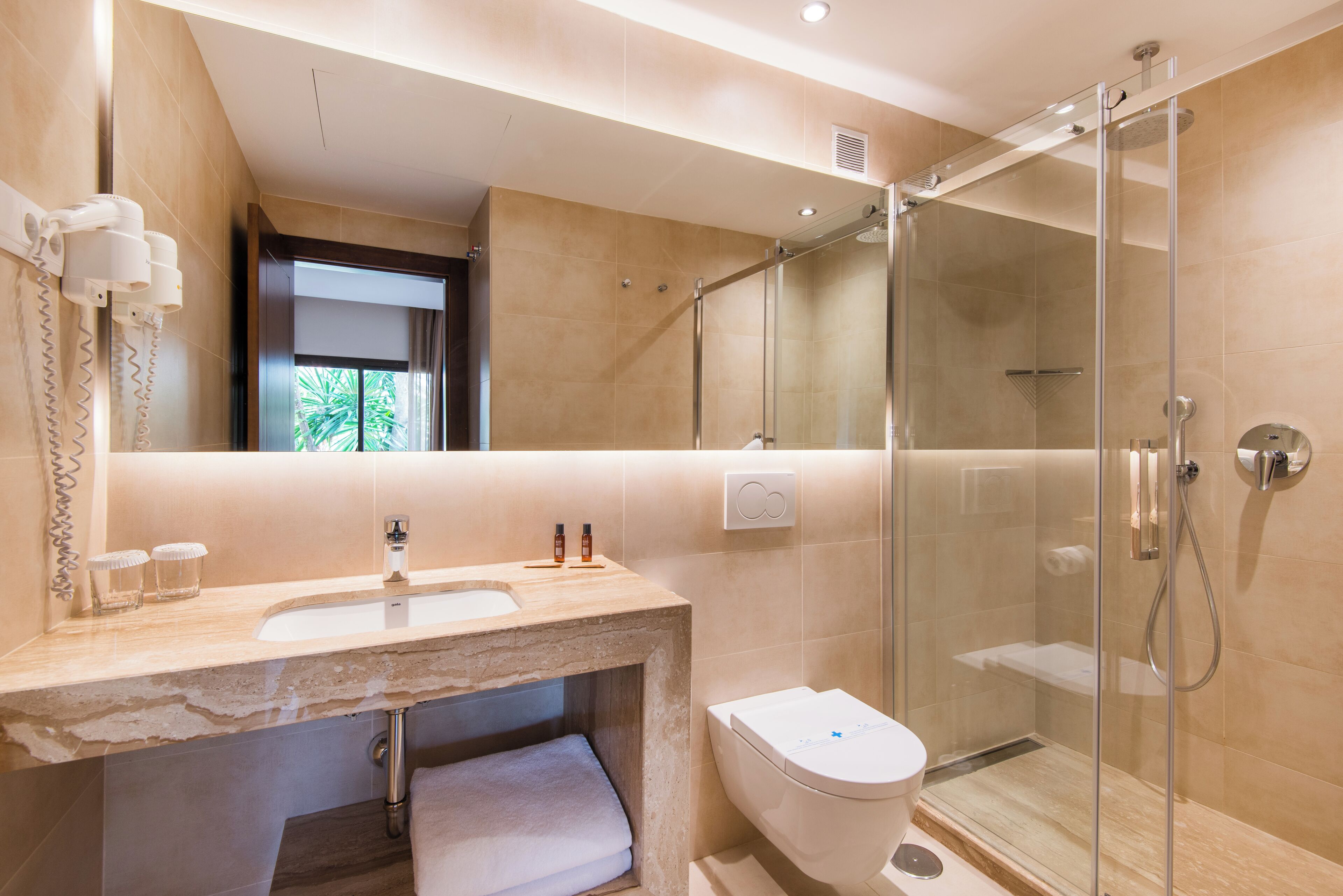 shower, rainfall showerhead, hair dryer, towels