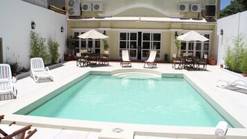 Outdoor pool, pool umbrellas, sun loungers