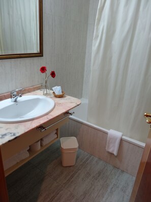 Bathtub, hair dryer, towels