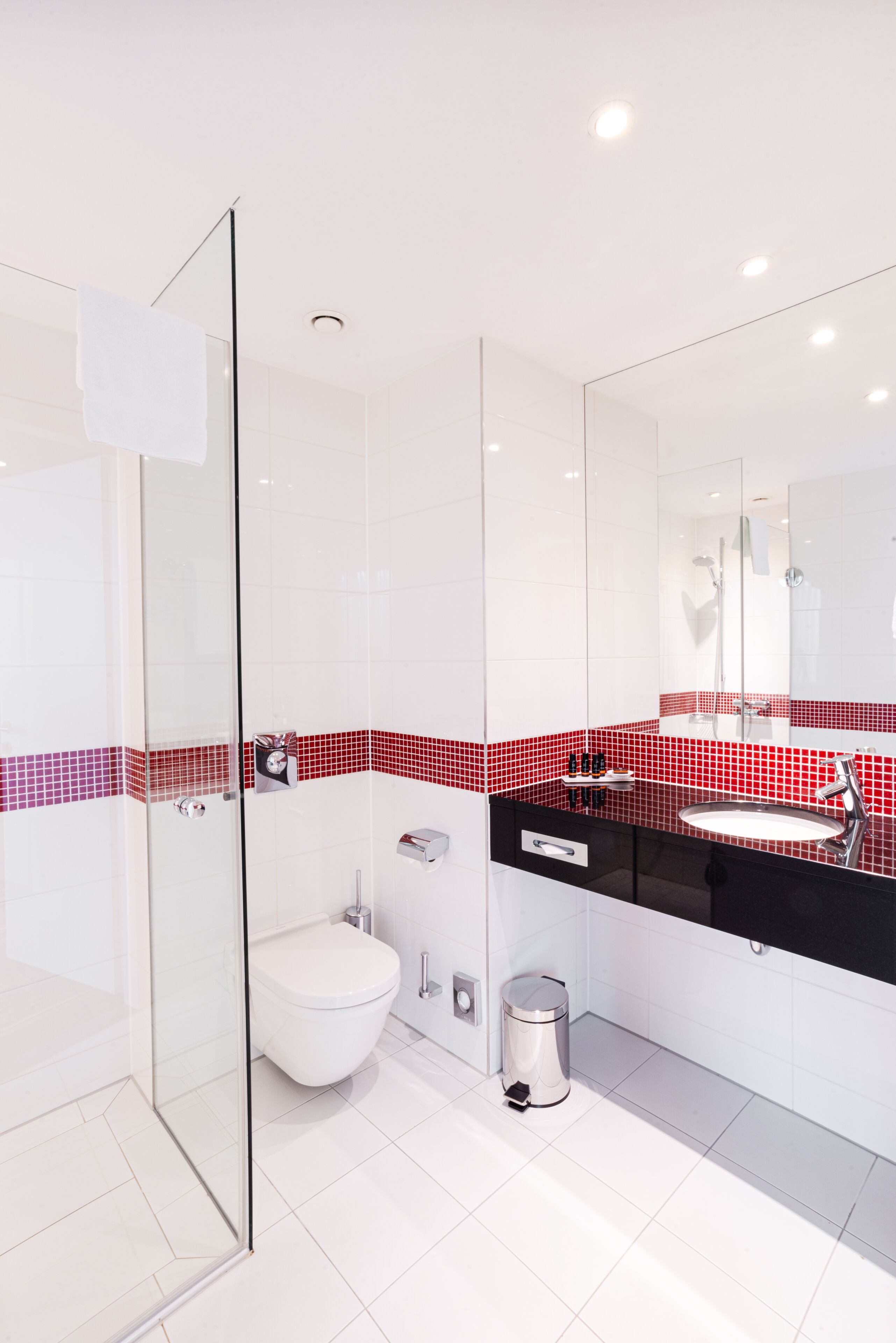 shower, designer toiletries, hair dryer, towels