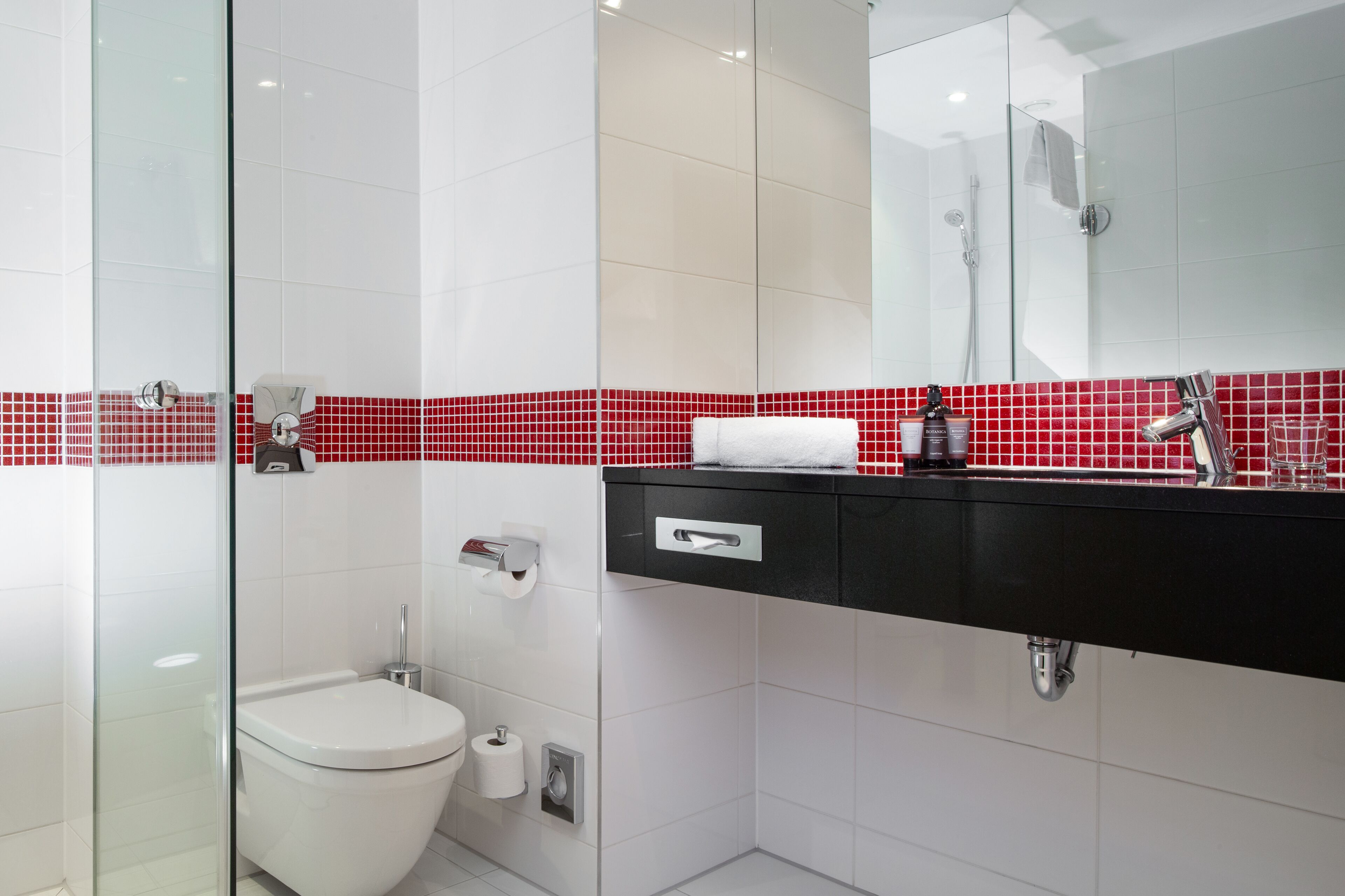 shower, designer toiletries, hair dryer, towels