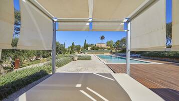 Indoor pool, outdoor pool, pool umbrellas, pool loungers