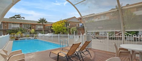 Seasonal outdoor pool, pool loungers