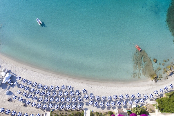 Private beach, white sand, sun loungers, beach umbrellas