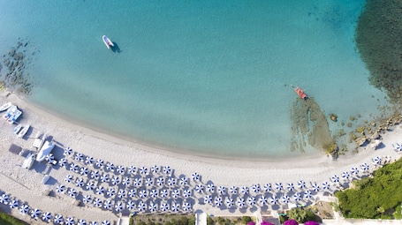 Private beach, white sand, sun loungers, beach umbrellas