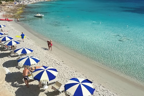 Private beach, white sand, sun loungers, beach umbrellas