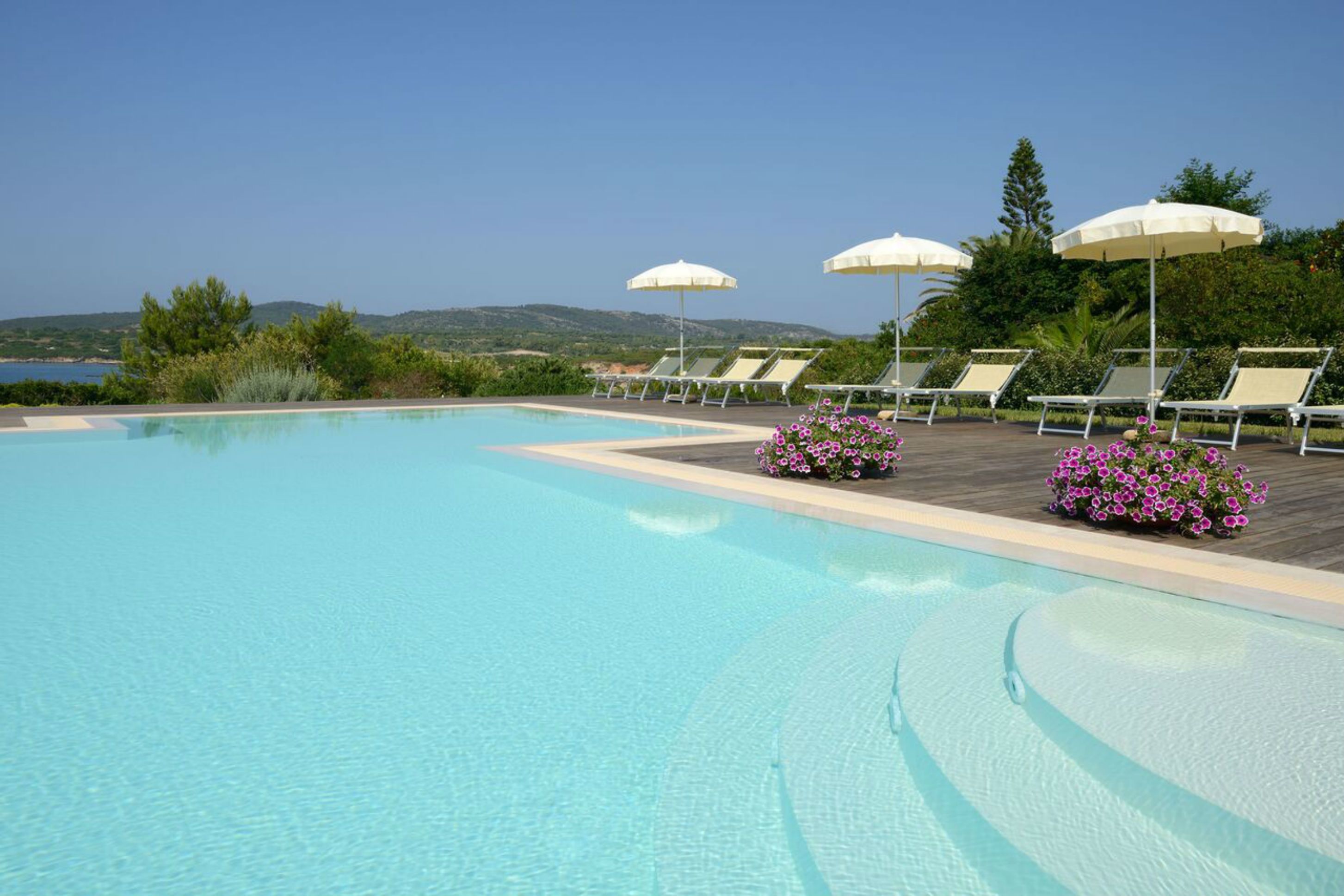 outdoor pool, pool umbrellas, pool loungers