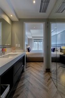 Deluxe Room, 1 King Bed with Sofa bed | Bathroom | Shower, designer toiletries, hair dryer, bathrobes