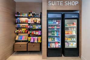 A suite shop with a variety of snacks, beverages, and packaged goods.