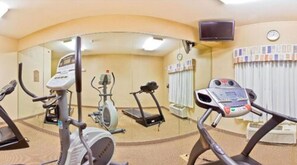 A gym with various exercise equipment including treadmills and stationary bikes. - Holiday Inn Express Forest City by IHG (Forest City)