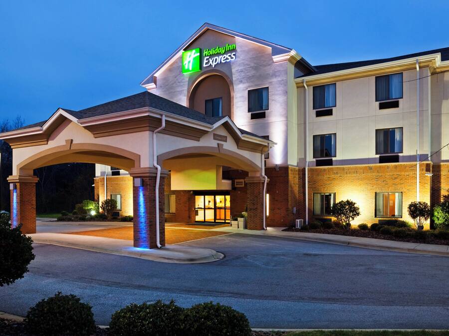 A Holiday Inn Express hotel with a central entrance, multiple floors, and a brick facade.