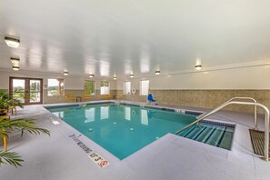 An indoor swimming pool with clear water, marked depth lines, and a no diving sign. - Hampton Inn Pine Grove (Pine Grove)