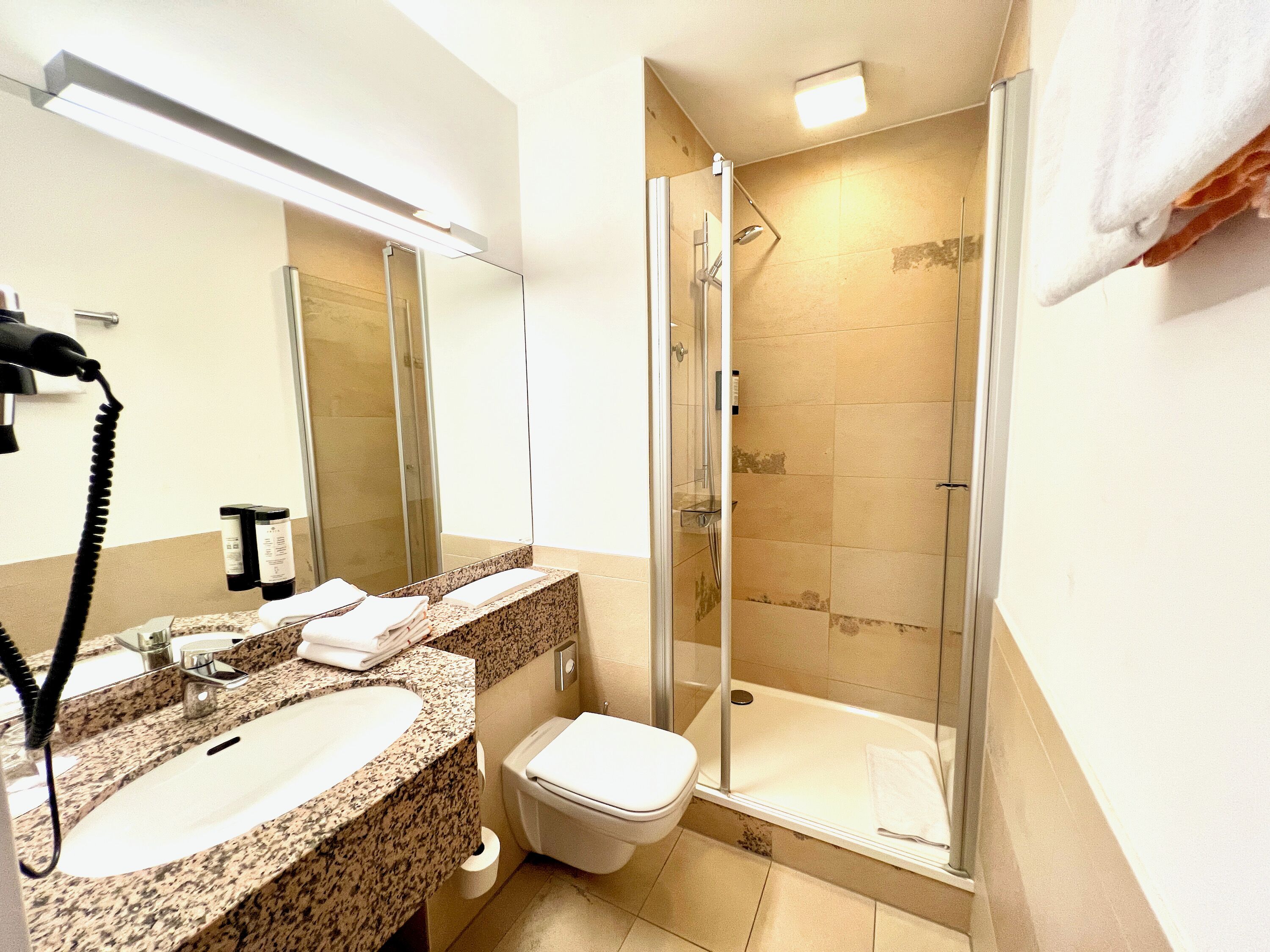 shower, eco-friendly toiletries, hair dryer, towels