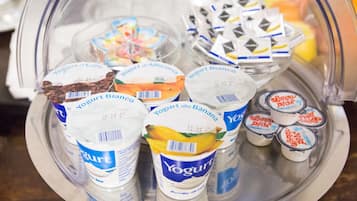 A variety of yogurt containers on a tray.