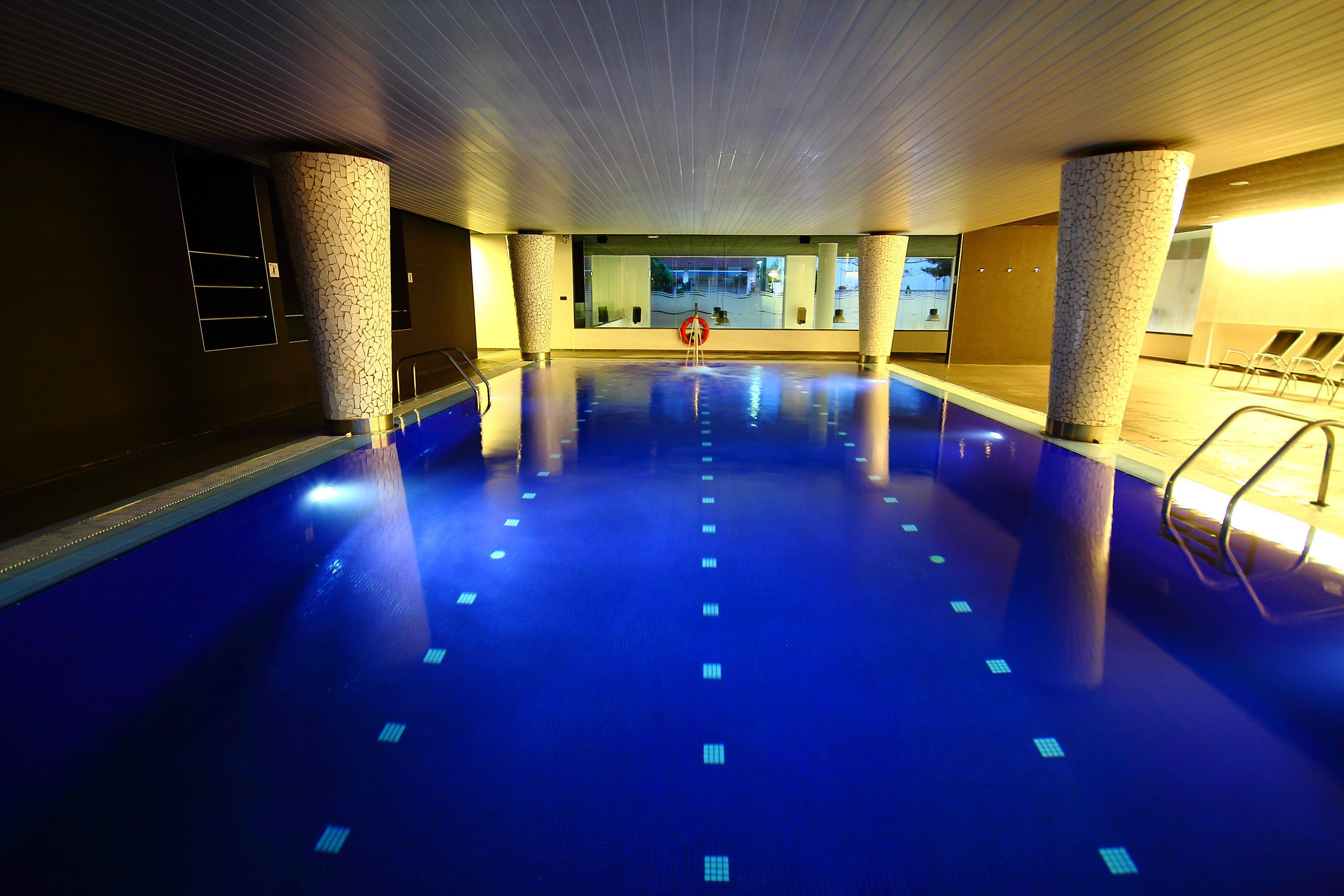 indoor pool, outdoor pool, pool umbrellas, pool loungers