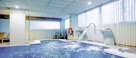 An indoor swimming pool with a diving board marked "1.30", a water fountain, and a lifebuoy.