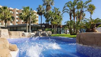 Indoor pool, outdoor pool, pool umbrellas, pool loungers