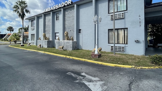 A building with the sign 'AMBASSADOR' and the number '4107' on the facade. - Ambassador Inn (Kissimmee)