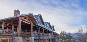 Experience a traditional getaway at this charming lodge, featuring a balcony with a view and outdoor dining options.