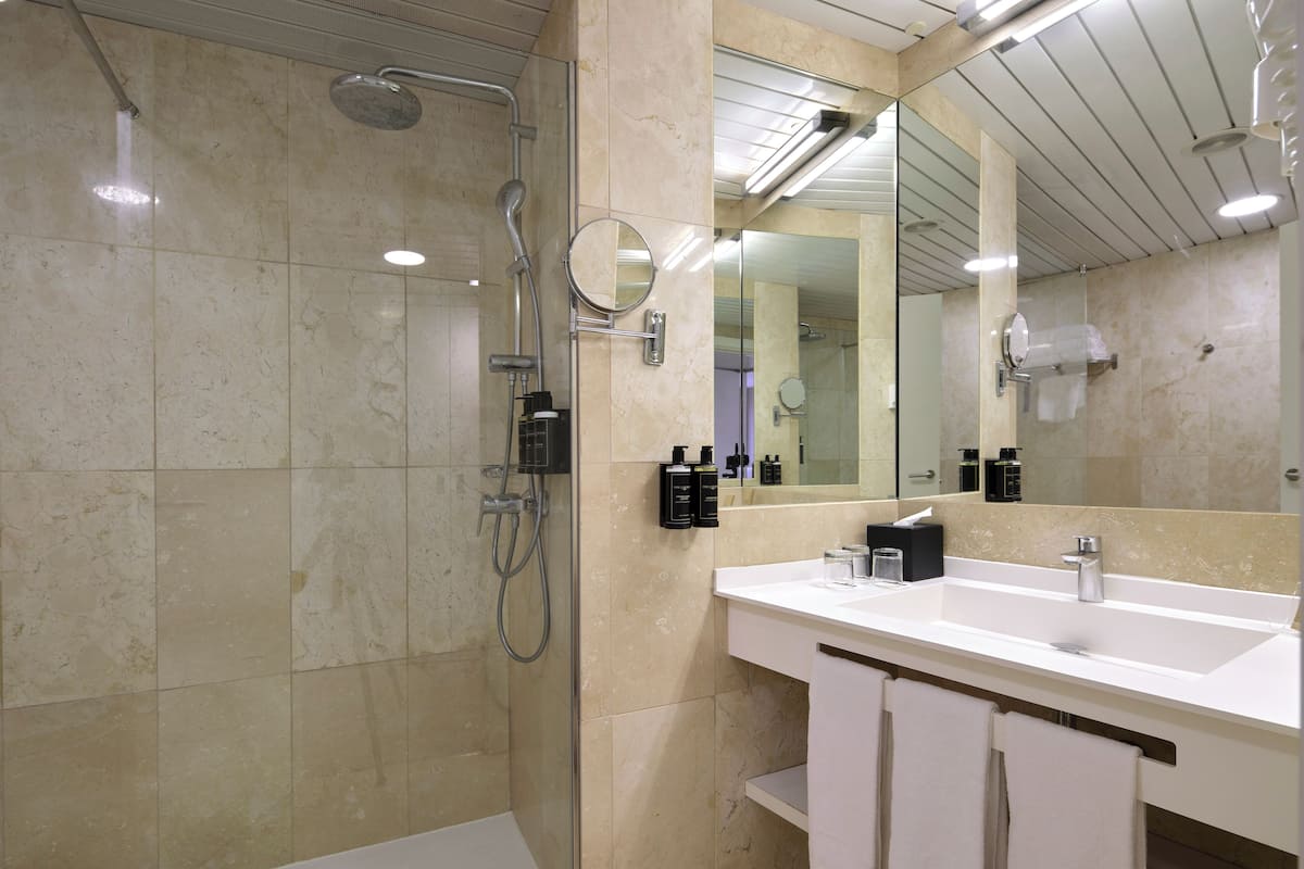 eco-friendly toiletries, hair dryer, towels, soap