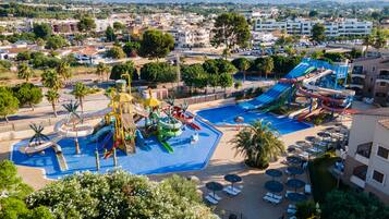 Experience the resort's vibrant water park and scenic mountain backdrop.