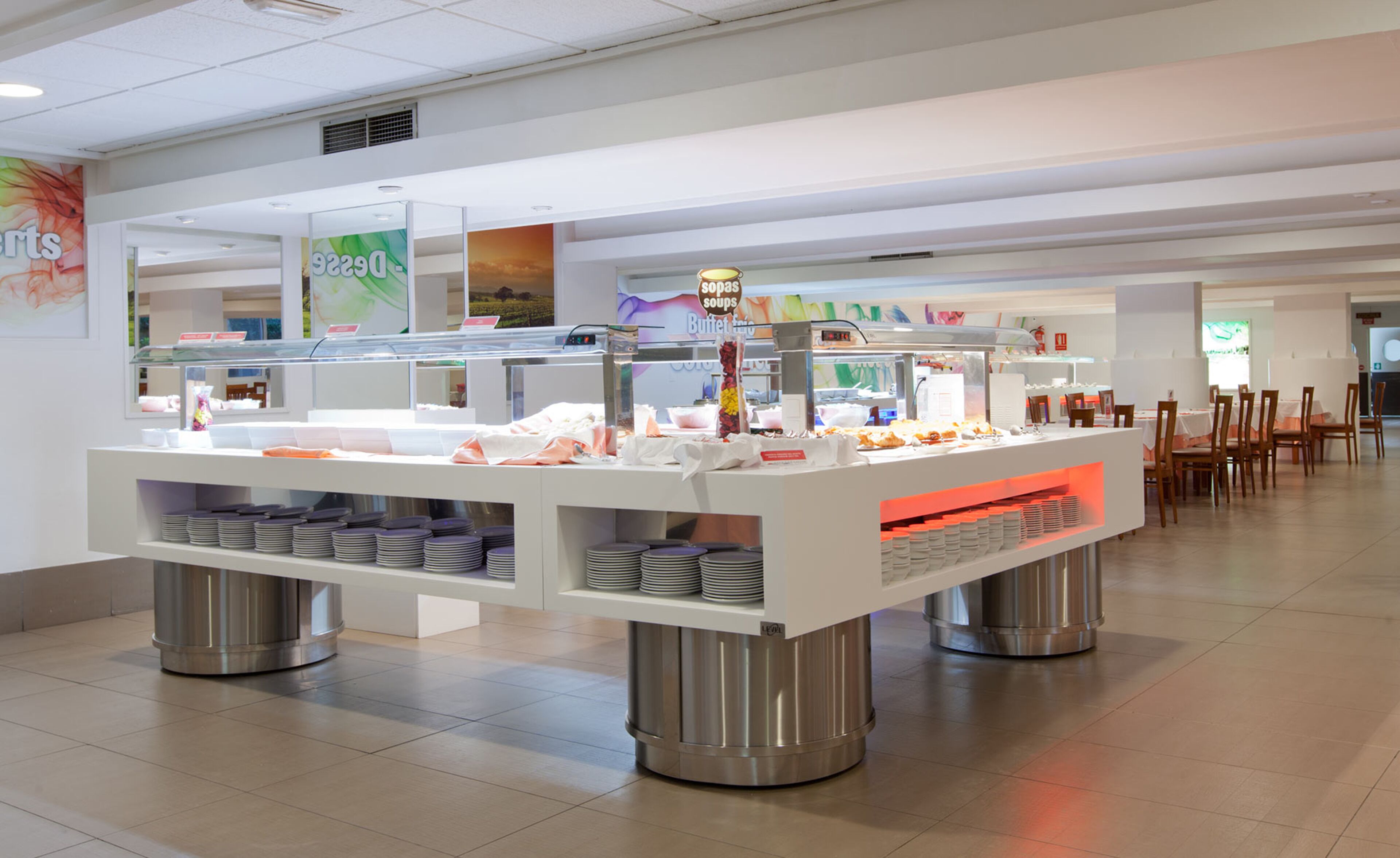 A buffet area with multiple serving stations, including a section for soups and a buffet line.