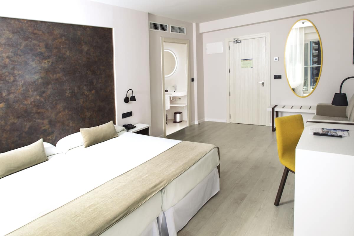Superior Double Room, Terrace, City View | Minibar, desk, blackout drapes, bed sheets