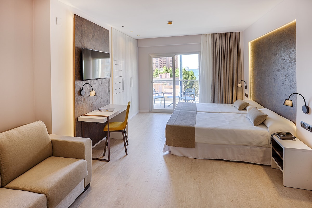 Minibar, desk, blackout drapes, bed sheets
