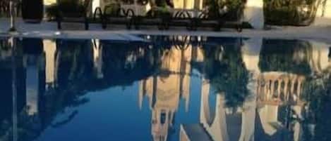 Seasonal outdoor pool, pool umbrellas, pool loungers