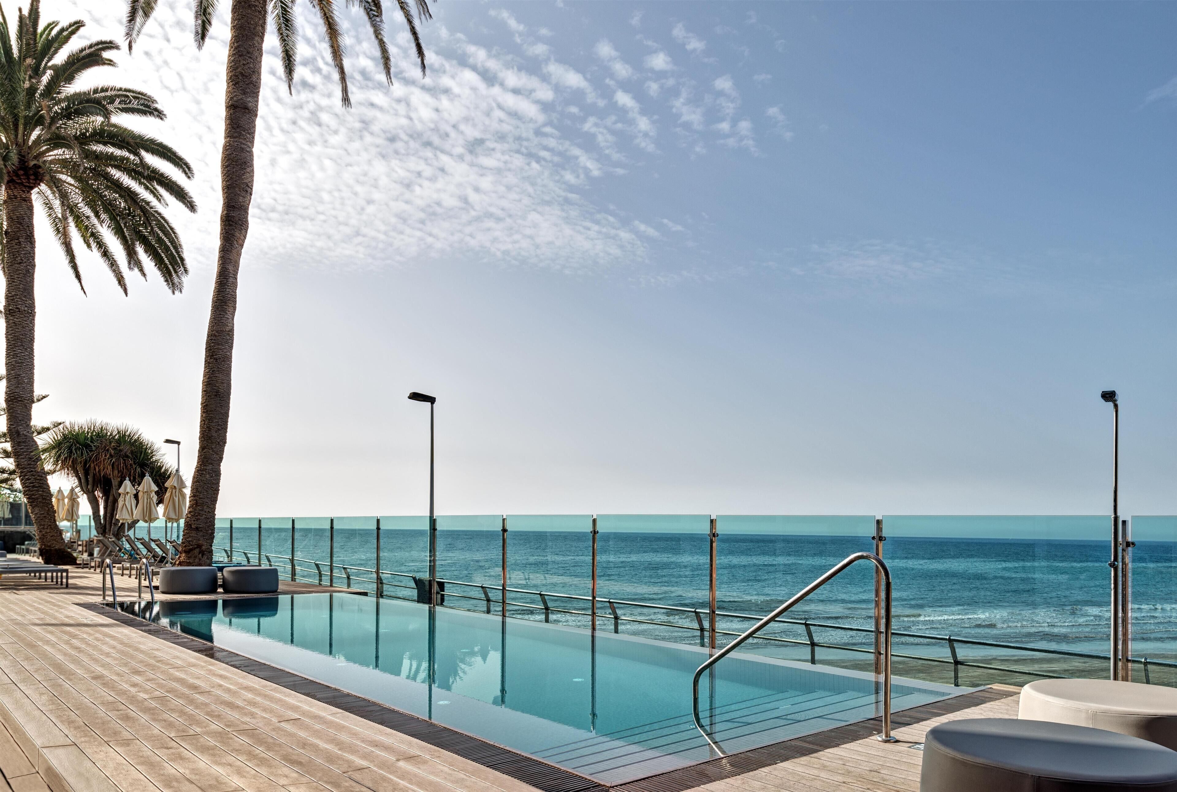 2 outdoor pools, pool umbrellas, pool loungers