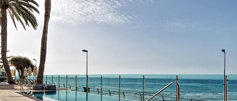 2 outdoor pools, pool umbrellas, pool loungers