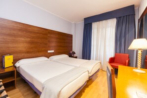 Minibar, desk, iron/ironing board, bed sheets