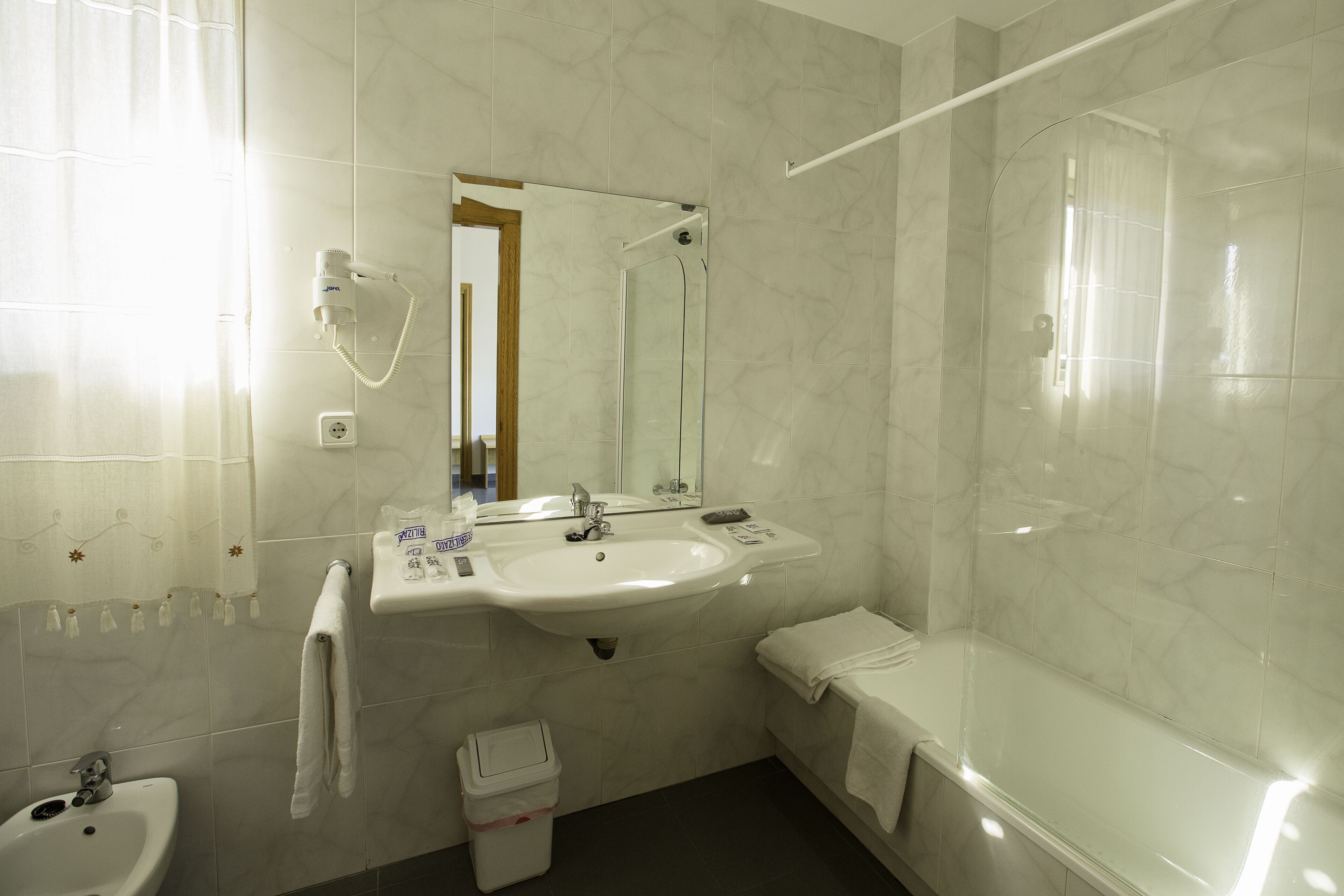 bathtub, free toiletries, hair dryer, bidet