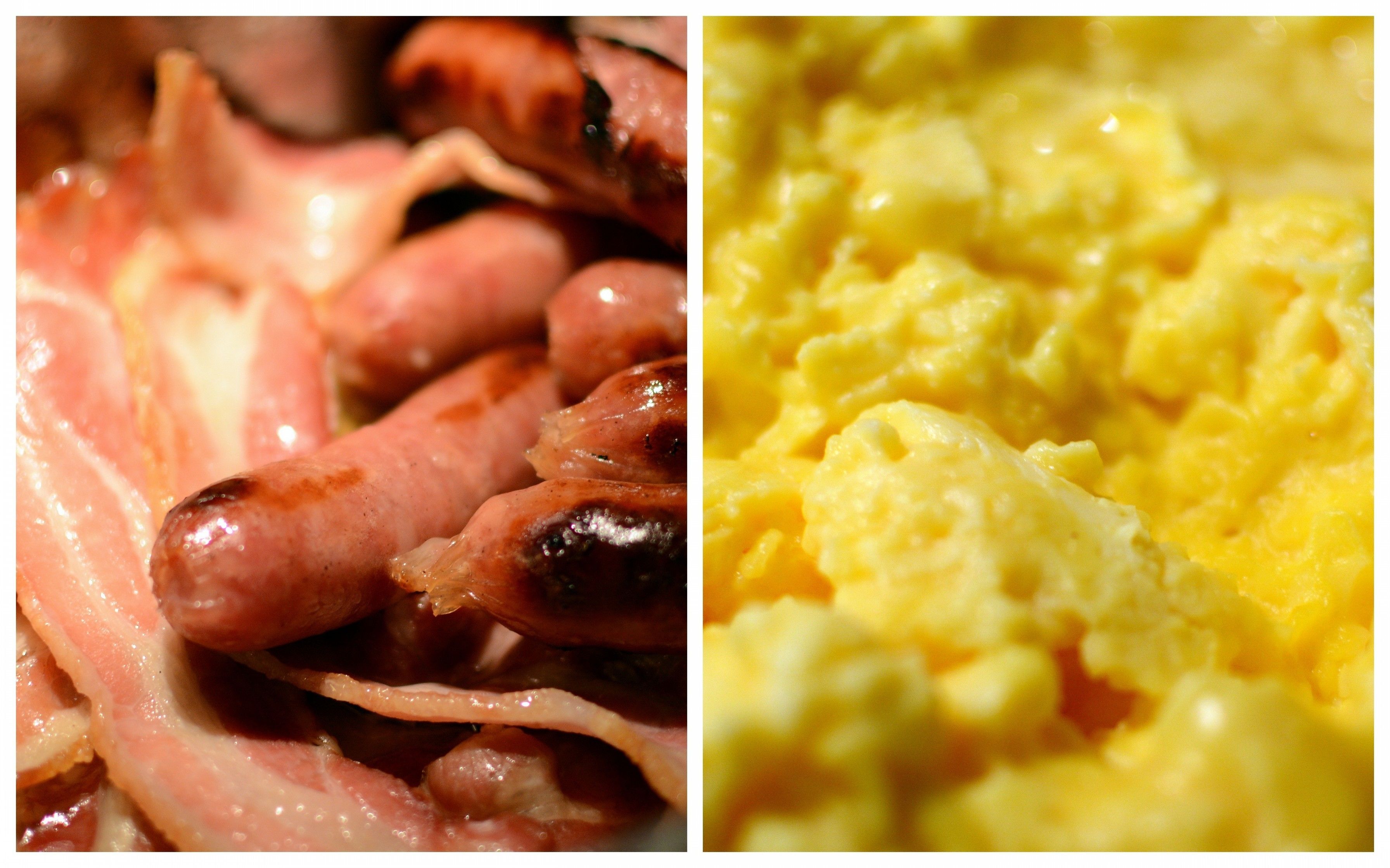 A close-up of cooked sausages and scrambled eggs.