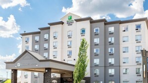 A Holiday Inn Express building with a modern design, featuring a prominent entrance and multiple windows. - Holiday Inn Express Hotel & Suites Edmonton North by IHG (Edmonton)