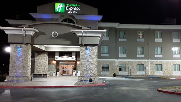 A Holiday Inn Express & Suites building with a stone facade, a central entrance with a canopy, and multiple windows. - Holiday Inn Express & Suites Woodward by IHG (Woodward)
